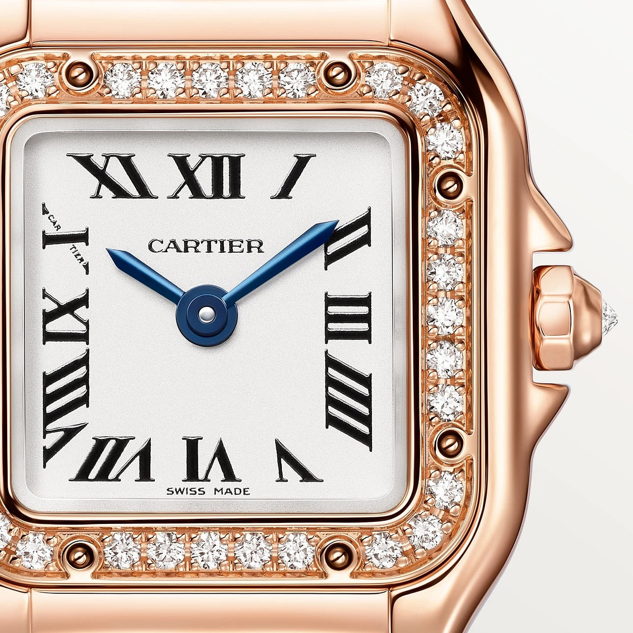 Close-up of the Panthère De Cartier Watch by Cartier, featuring a diamond bezel, Roman numerals, blue hands, and a rose gold case.