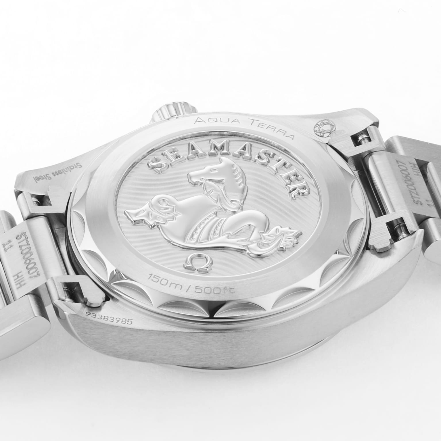 Close-up of the back of an OMEGA Seamaster Aqua Terra 150M, highlighting its engraved seahorse and branding, with part of the metal bracelet in view.