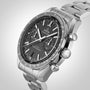 A close-up of the OMEGA Speedmaster Racing, featuring a black dial with three subdials, tachymeter bezel, and stainless steel bracelet—highlighting the precision of this Master Chronometer.