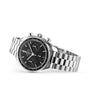 The OMEGA Speedmaster 38 is a stainless steel wristwatch with a black dial, three subdials, tachymeter bezel, and metal link bracelet—an iconic choice among OMEGA chronographs.