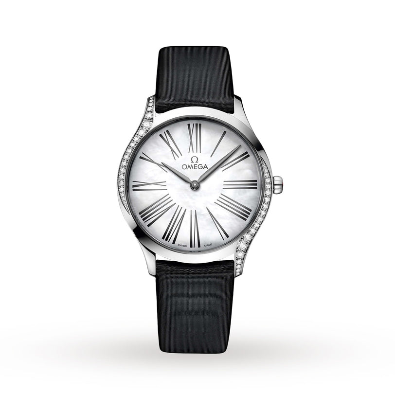 The OMEGA De Ville Tresor 36, a silver ladies’ watch with a white dial, black Roman numerals, diamond-paved case accents, and black strap is displayed against a plain white background.