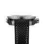 Side view of the OMEGA Seamaster Planet Ocean 600M wristwatch featuring a black textured strap, visible metal crown, and bezel.