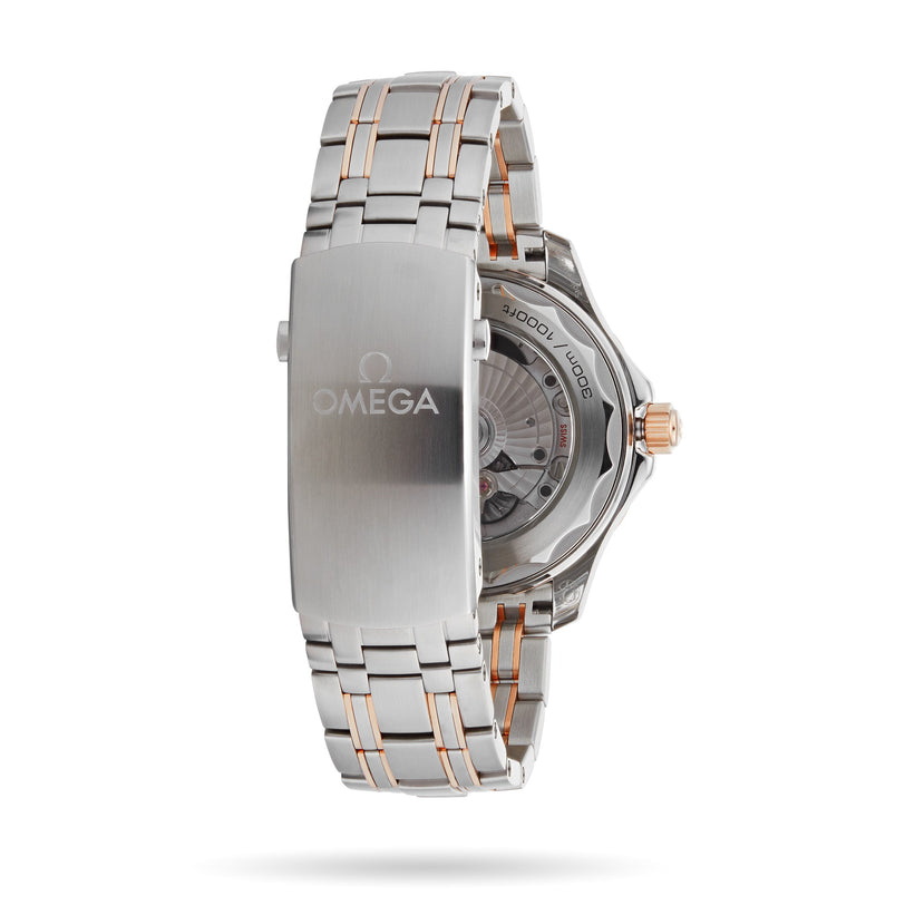 An OMEGA Seamaster Diver 300M wristwatch in stainless steel and rose gold shown from the back, highlighting the clasp and transparent case back with visible OMEGA Co-Axial movement.