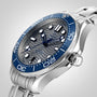 A close-up of the OMEGA Seamaster Diver 300M featuring a blue ceramic bezel, wavy dial, stainless steel bracelet, and powered by the OMEGA Calibre 8800.