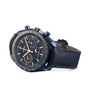 A blue OMEGA Speedmaster 44 Ceramic wristwatch featuring a dark strap, three subdials, and a moonphase indicator powered by the 9904 calibre, displayed at an angle on a white background.