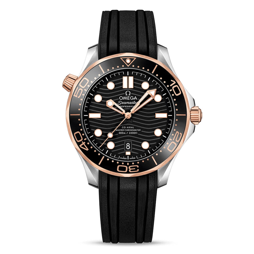 OMEGA Seamaster Diver 300M with a black rubber strap, black dial, gold accents, wavy pattern, date at 6 o’clock, and Ceragold bezel markings.