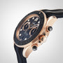 Close-up of the OMEGA Seamaster Diver 300M, featuring a black bezel, black and gold dial, and black rubber strap, photographed against a plain light background.