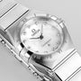 The OMEGA Constellation features a 28mm stainless steel case, white mother-of-pearl dial, diamond hour markers, and Roman numerals on the bezel.