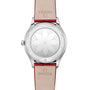 The back of the OMEGA De Ville Tresor 36 features a geometric floral pattern engraved on the case and red leather straps embossed with the OMEGA logo.