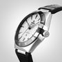 An OMEGA Constellation wristwatch with a textured white dial, Roman numeral markers, black bezel, and black leather strap, powered by the Master Chronometer 8900 Calibre Movement, is shown angled against a plain background.