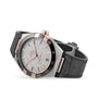 An OMEGA Constellation wristwatch with a textured silver dial, rose gold accents, black Roman numeral bezel, and black leather strap featuring the precise 8900 calibre movement. Displayed angled on a white background.
