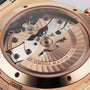 Close-up of the OMEGA Constellation’s Master Co-Axial 8901 calibre movement, visible through the transparent case back, showcases refined Sedna™ gold details that celebrate the collection’s heritage.