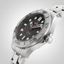 The OMEGA Seamaster Diver 300M Nekton Edition, featuring a stainless steel case, black ceramic wave-pattern dial with large white indexes, date window, and steel bracelet, is displayed on a light background.