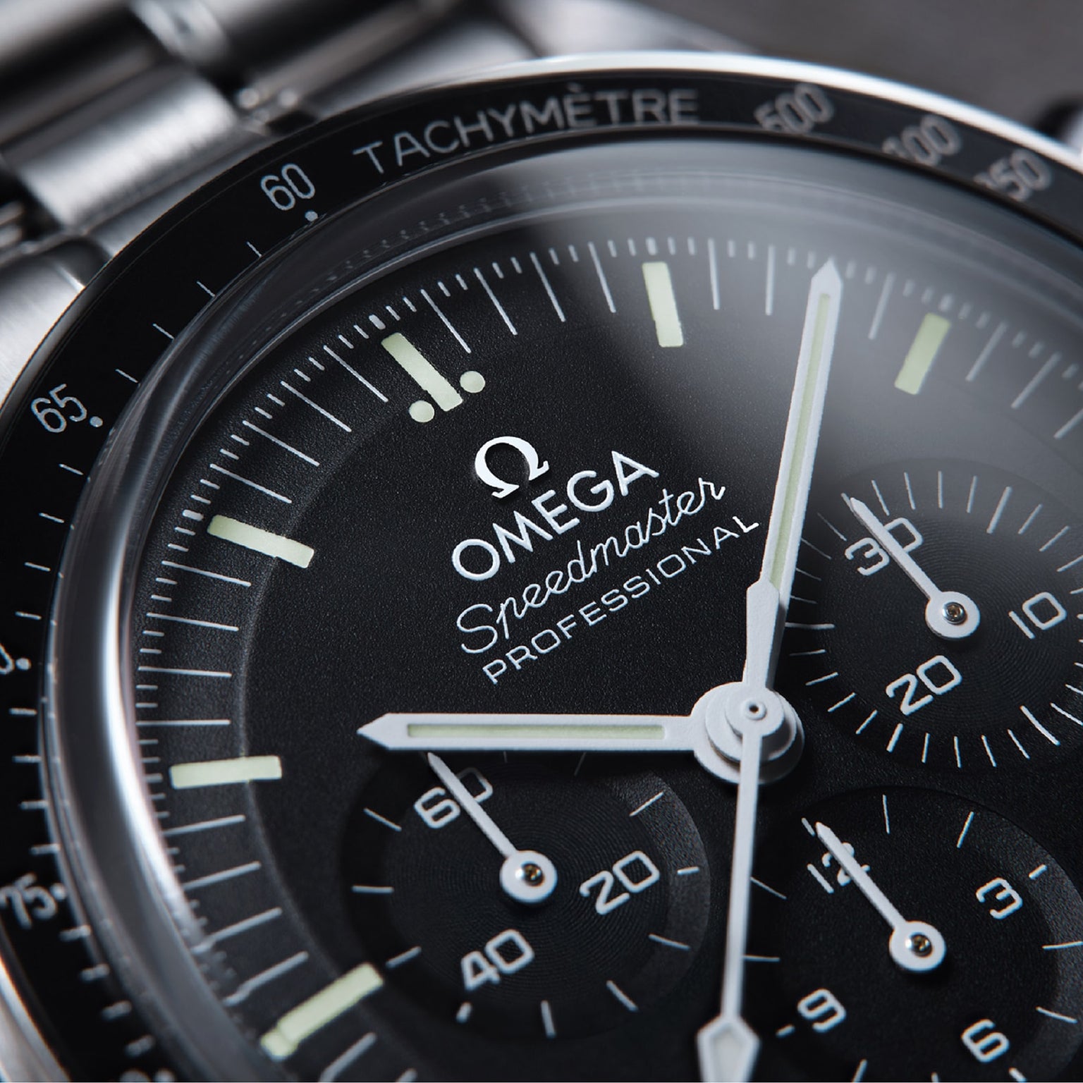 Close-up of the OMEGA Speedmaster Moonwatch Professional, highlighting its dial, chronograph subdials, and tachymeter scale.