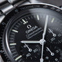 Close-up of the OMEGA Speedmaster Moonwatch Professional, highlighting its dial, chronograph subdials, and tachymeter scale.