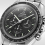 Close-up of the OMEGA Speedmaster Moonwatch Professional, a stainless steel wristwatch featuring a black dial, three subdials, and a tachymeter bezel.