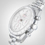 An OMEGA Speedmaster 38 stainless steel chronograph with a white dial, tachymeter bezel, and metal bracelet is displayed at an angle on a light gray background.