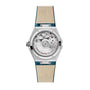 The back of the OMEGA Constellation shows its exposed Co-Axial Master Chronometer Calibre 8802 and Omega Master Co-Axial text, paired with a beige and teal leather strap.