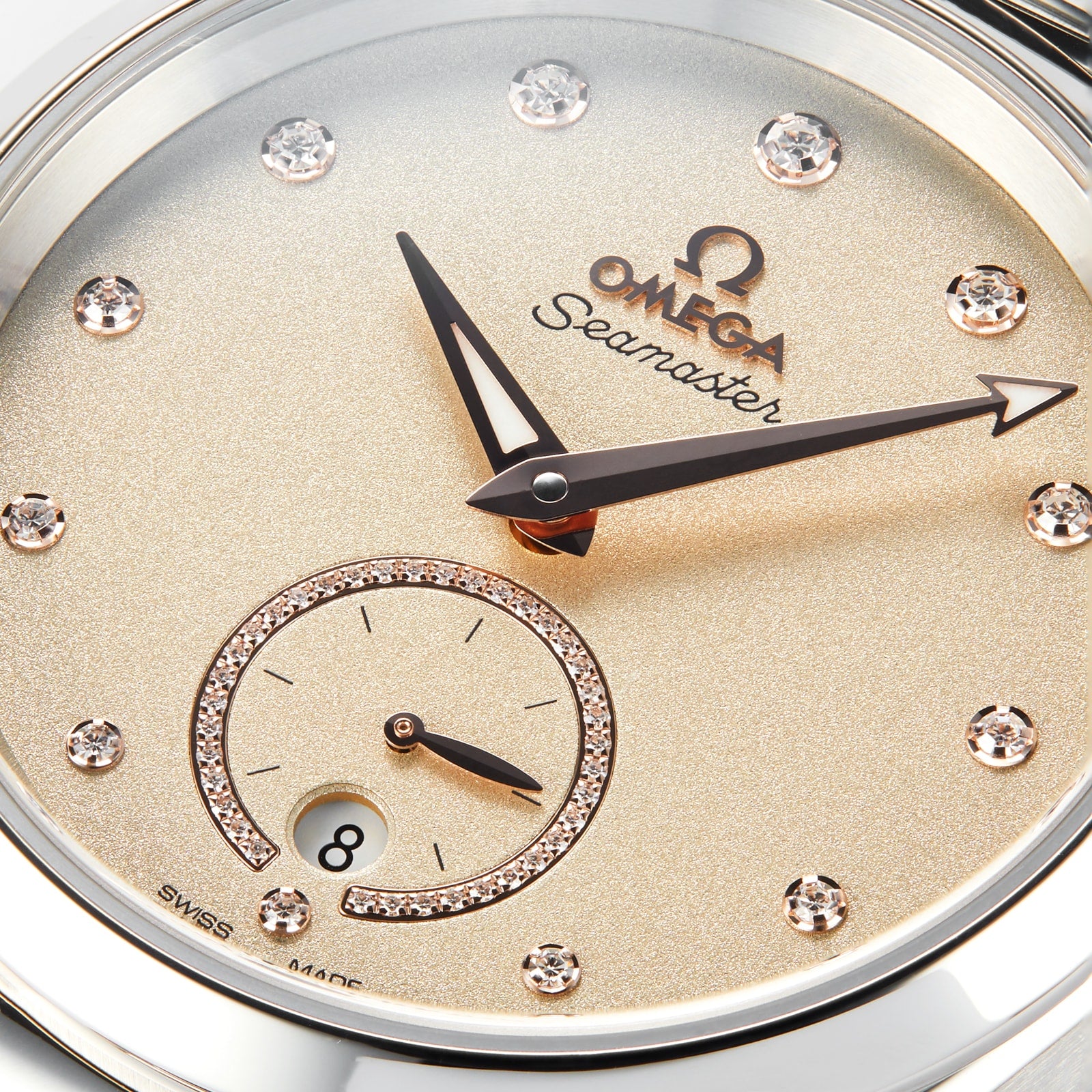 Close-up of the OMEGA Seamaster Aqua Terra 150M watch face with diamond hour markers, sub-seconds dial, date display, gold-toned hands, and precision 8802 calibre movement—a tribute to OMEGA’s maritime legacy.