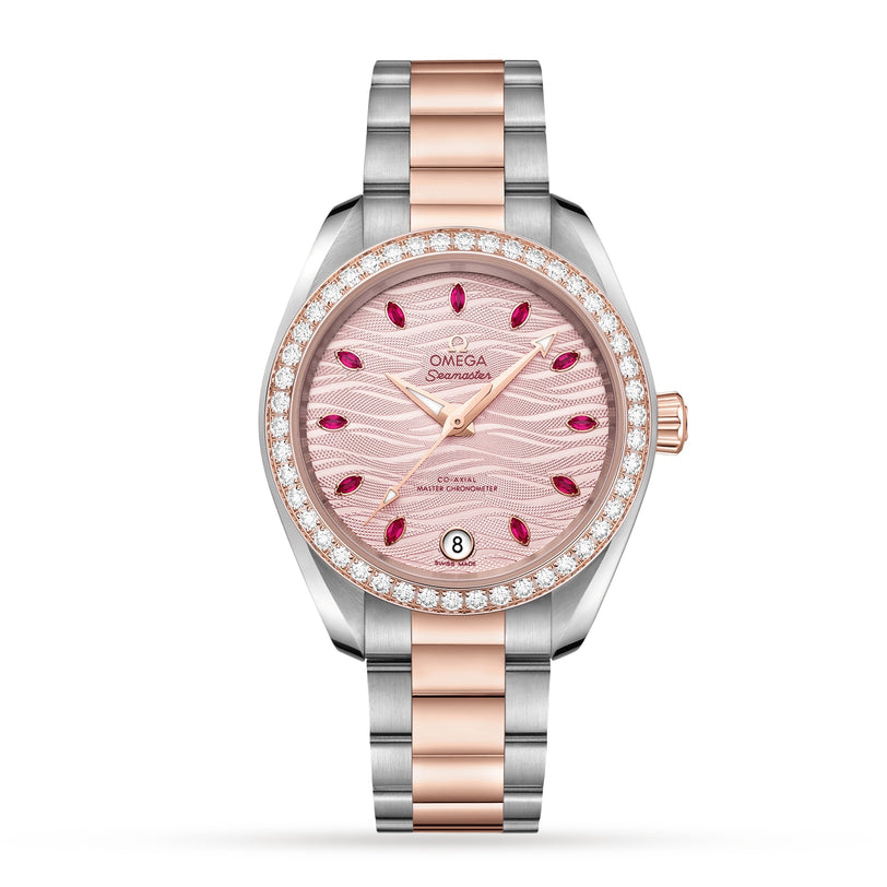 The OMEGA Seamaster Aqua Terra 150M ladies watch boasts a pink dial, diamond bezel, ruby hour markers, date at 6 o’clock, and a stainless steel and rose gold bracelet—crafted to OMEGA Master Chronometer standards.