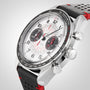 Close-up of the OMEGA Speedmaster Chronoscope, showcasing its 43mm stainless steel case, white dial, black tachymeter bezel, black and red highlights, and a perforated black leather strap with red lining.