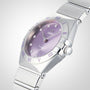 An OMEGA Constellation watch with a silver stainless steel bracelet, purple dial featuring diamond hour markers, and Roman numerals on the bezel is shown against a plain white background.