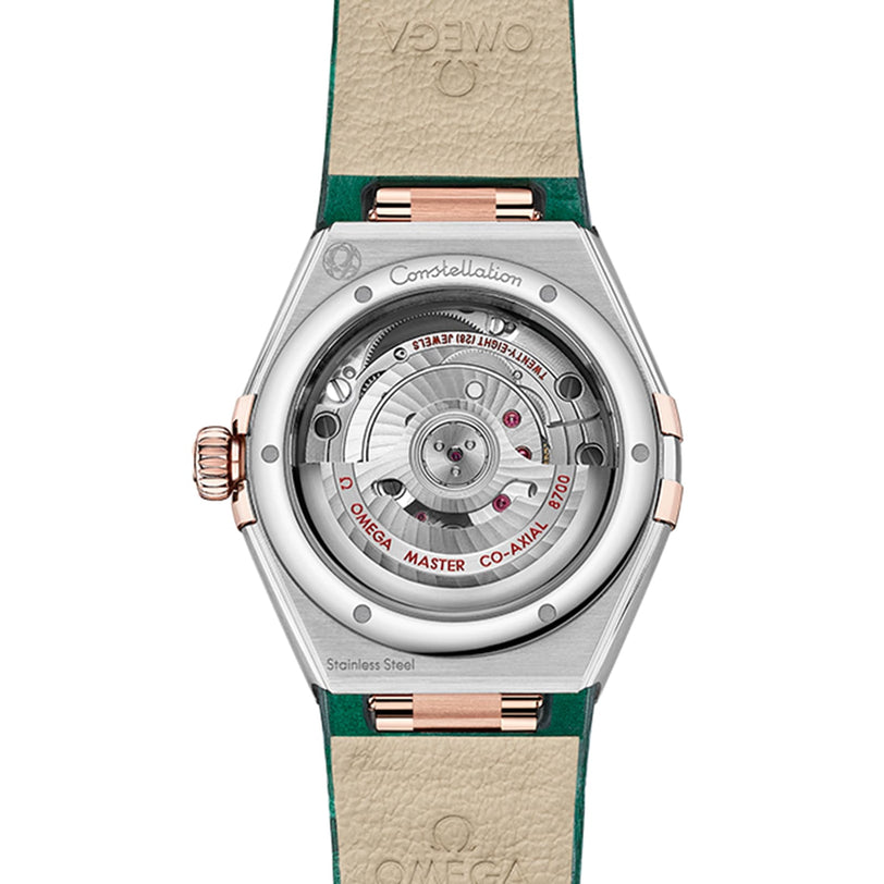 Back view of the OMEGA Constellation watch features a transparent caseback that reveals its master chronometer-certified movement and stainless steel components, engraved with technical details.