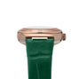 Close-up of the OMEGA Constellation timepiece with an aventurine stone dial, 18K Sedna™ gold case, Roman numerals, and a green leather strap.