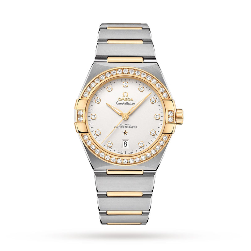 The OMEGA Constellation is a two-tone wristwatch with diamond-paved bezel, gold accents, a silver dial with gold hour markers, Master Chronometer Calibre 8800 movement, and a date window at 6 o’clock.