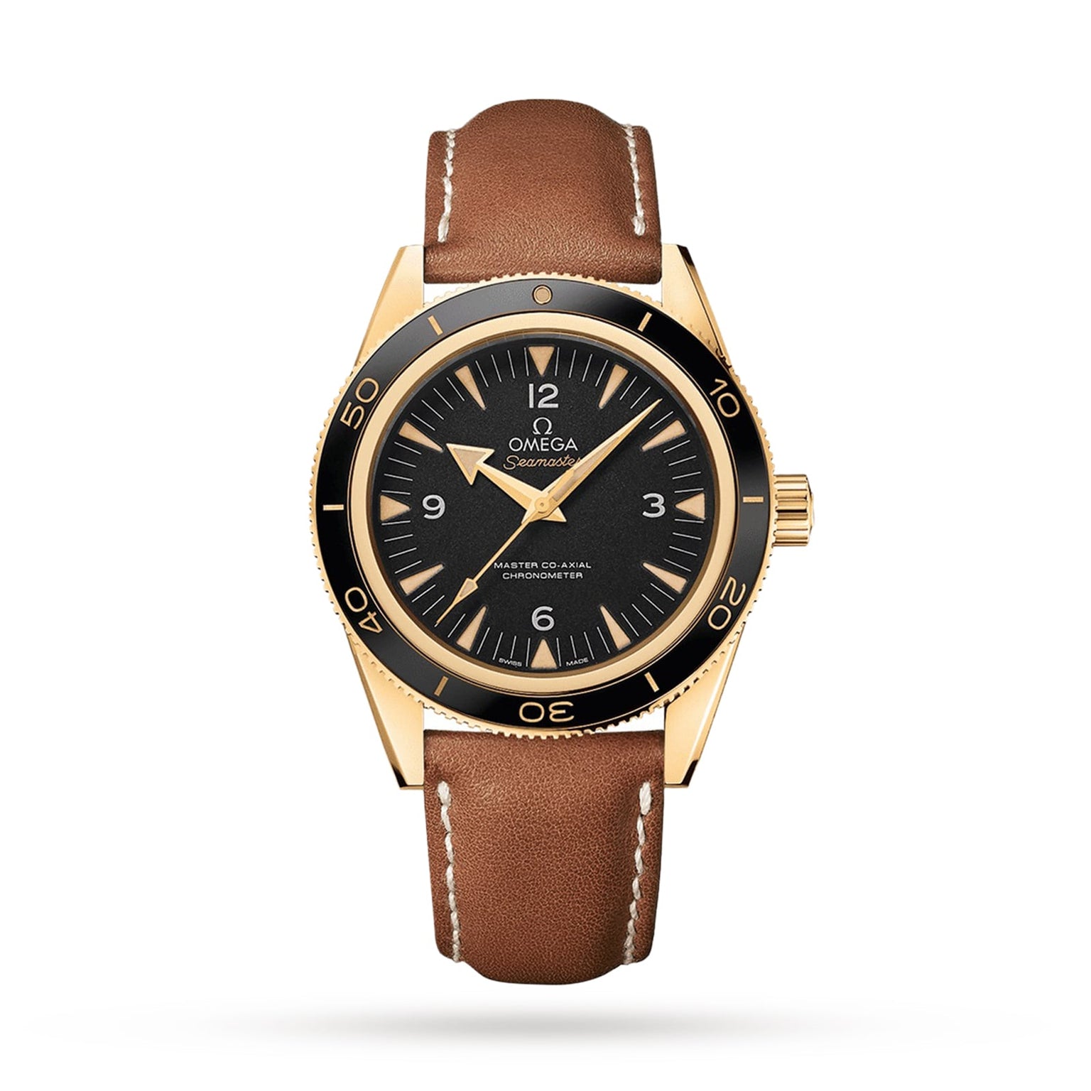An OMEGA Seamaster 300 diving watch in gold with a black dial, brown leather strap, and white stitching is shown against a plain white background.