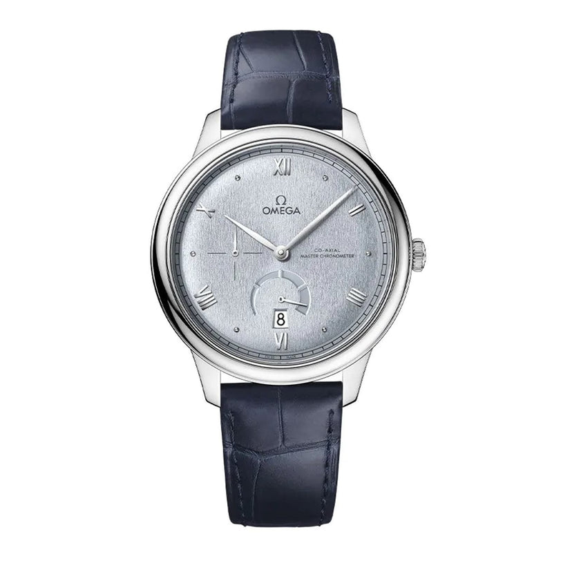 The OMEGA De Ville Prestige is a stainless steel wristwatch with a light gray dial, Roman numerals, a date window at 6 o’clock, and a dark blue leather strap.
