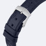 Close-up of a black leather strap with a silver buckle engraved with the OMEGA logo, designed for the De Ville Prestige by OMEGA, featuring multiple adjustment holes.