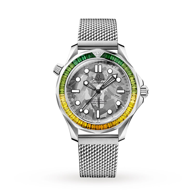 The OMEGA Seamaster Diver 300M James Bond 60th Anniversary features a stainless steel case, mesh strap, grey textured dial, and a bezel set with a green-to-yellow gradient of gemstones.