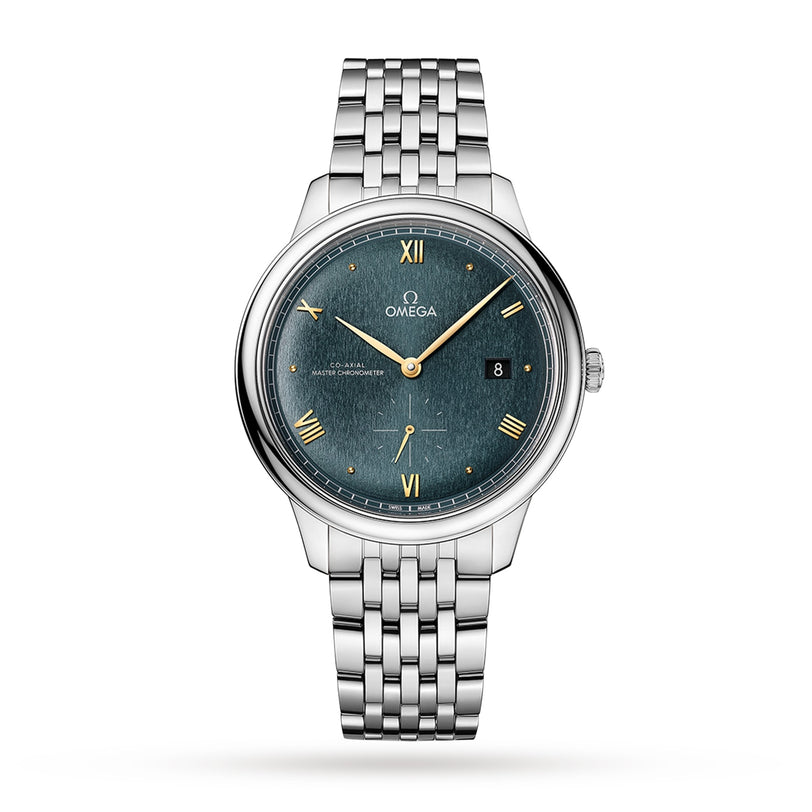 The OMEGA De Ville Prestige features a silver case, green textured dial with gold Roman numerals, a date window at 3 o’clock, and a metal link bracelet, showcasing refined elegance against a white background.