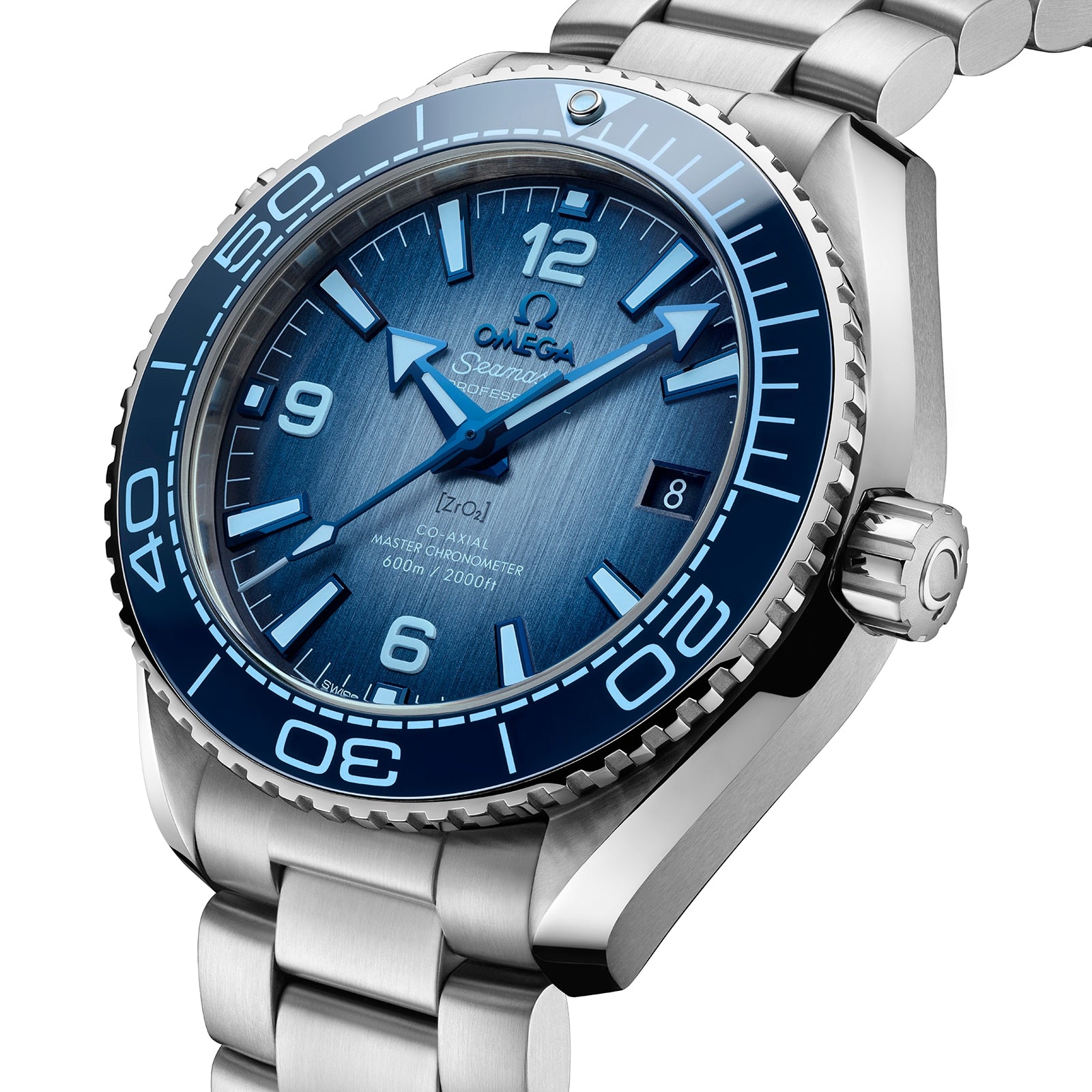 A close-up of the OMEGA Seamaster Planet Ocean 600M Summer Blue dive watch, featuring a blue gradient dial, blue bezel, silver indices, date window, and stainless steel bracelet with Master Chronometer precision.