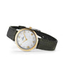 The OMEGA De Ville Prestige wristwatch features a green leather strap, mother-of-pearl dial, gold bezel and Roman numerals, plus diamond hour markers, displayed at an angle against a white background.