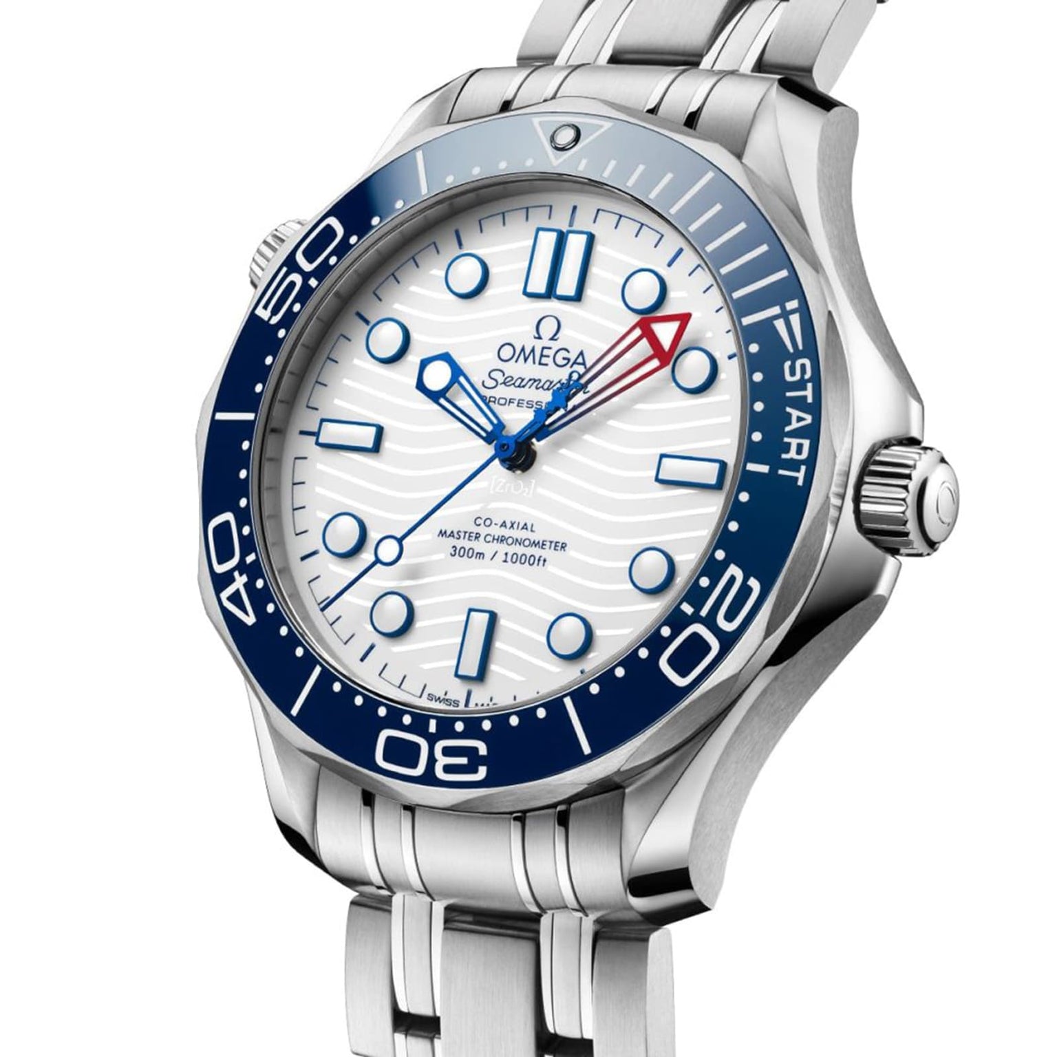 A close-up of the OMEGA Seamaster Diver Americas Cup 300M shows its blue bezel, white textured dial, and stainless steel bracelet. The watch features prominent minute markers and displays time and date.