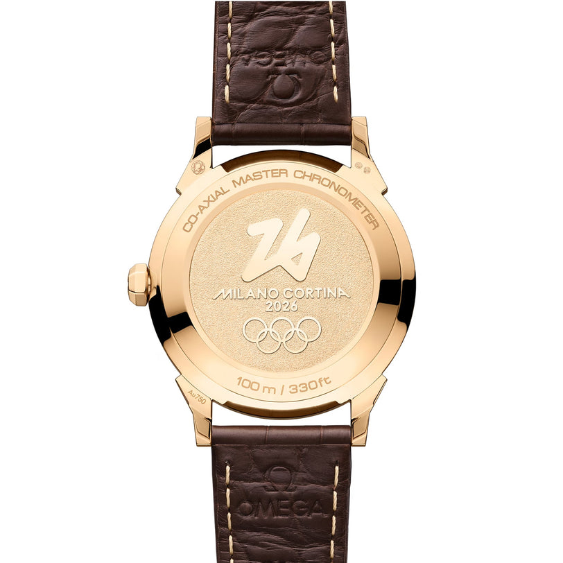 Back view of a gold OMEGA Seamaster Moonshine wristwatch with “Milano Cortina 2026” and Olympic rings engraved on the case, paired with a brown leather strap.