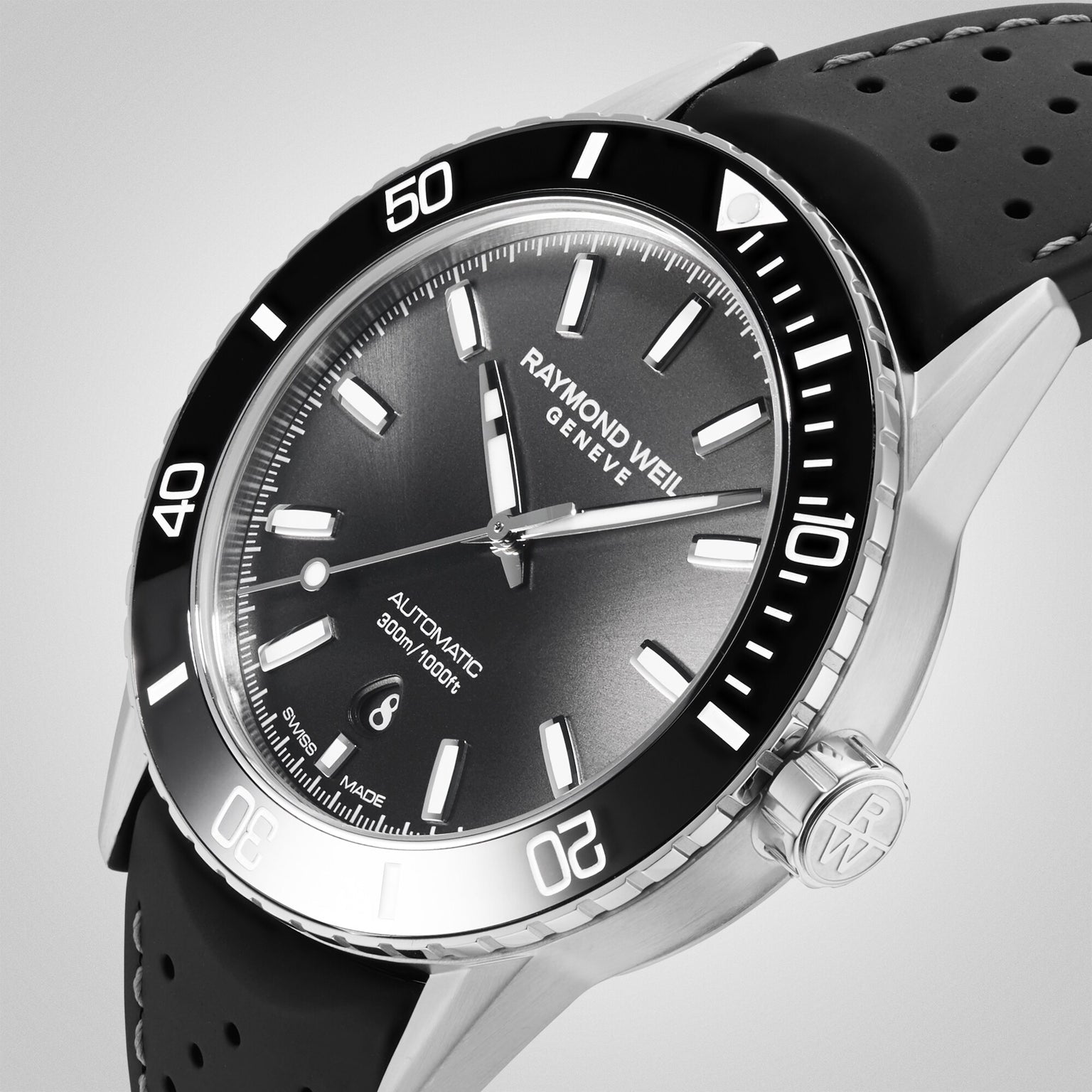 The Raymond Weil Freelancer Diver Black Dial watch features a sleek black dial, black bezel, perforated strap, and date display at 6 o’clock—a refined choice for those seeking affordable luxury.