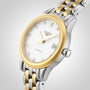 The Longines Flagship two-tone automatic features a gold and silver band, white dial with diamond indexes, L592 calibre movement, and date display at 3 o’clock.