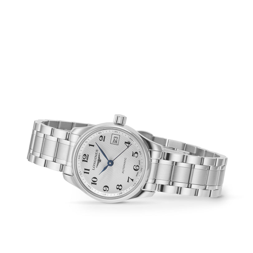 The Longines Master Collection wristwatch features a silver stainless steel bracelet, white dial with black Arabic numerals, three hands, date at 3 o’clock, and is shown on a plain white background.