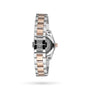 A close-up of the back of a Longines Conquest Classic wristwatch with a stainless steel and PVD bracelet in silver and rose gold, highlighting the clasp and case back on a white background.