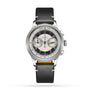 The Longines Tuxedo is a stainless steel chronograph from the Heritage Classic line, with a black and cream dial, two subdials, blue accents, calibre L895 automatic movement, and a black leather strap.