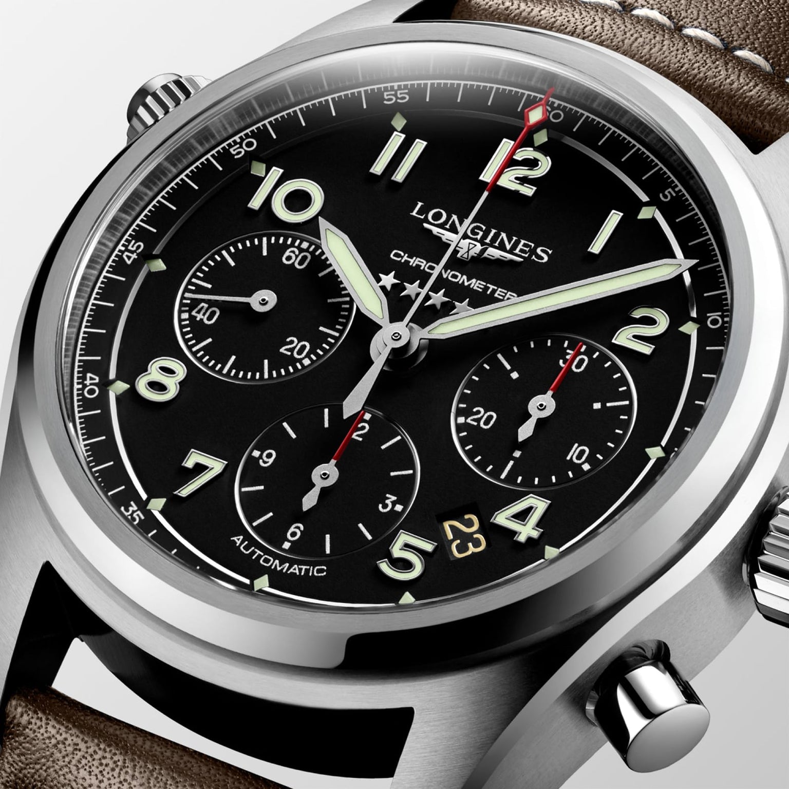 Close-up of the Longines Spirit Chronograph, featuring a black dial with three subdials, luminous hands, date window, brown leather strap, and powered by the chronometer-certified L688.4 calibre movement.