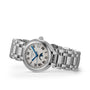 The Longines PrimaLuna Moonphase is a silver wristwatch featuring a white dial, Roman numeral hour markers, stainless steel case, moonphase and date displays, and a metal link bracelet.
