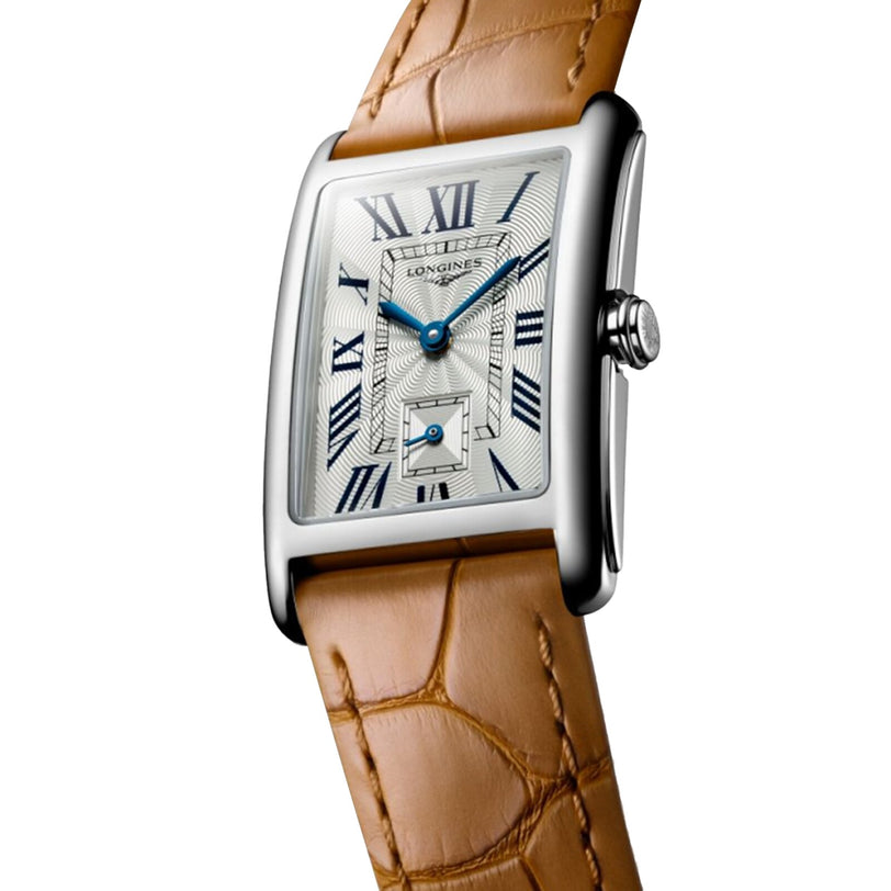The Longines DolceVita features a rectangular silver case, white dial, blue hands, Roman numerals, date window, and a brown leather strap for timeless elegance.