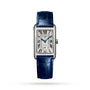 The Longines DolceVita is a rectangular silver watch featuring a textured face, blue Roman numerals, and a blue leather strap.