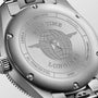 Close-up of the Longines Spirit Zulu Time’s case back shows engraved text, a globe with wings logo, and serial/model numbers on its stainless steel case.