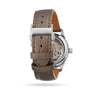 The back view of the Longines Master Collection displays its automatic movement through the caseback, complemented by a brown leather strap and stainless steel buckle engraved with Longines for an elegant finish.