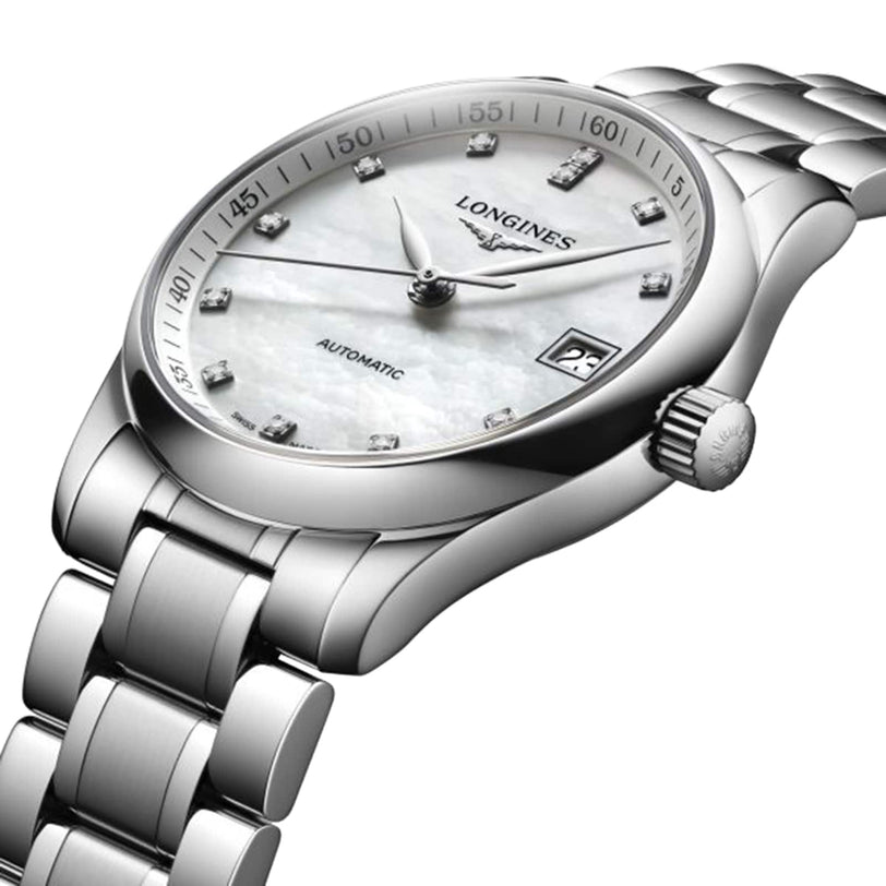 The Longines Master Collection wristwatch features a silver case, white dial with diamond hour markers, date at 3 o’clock, and automatic movement, displayed from an angle—an elegant example of horological craftsmanship.
